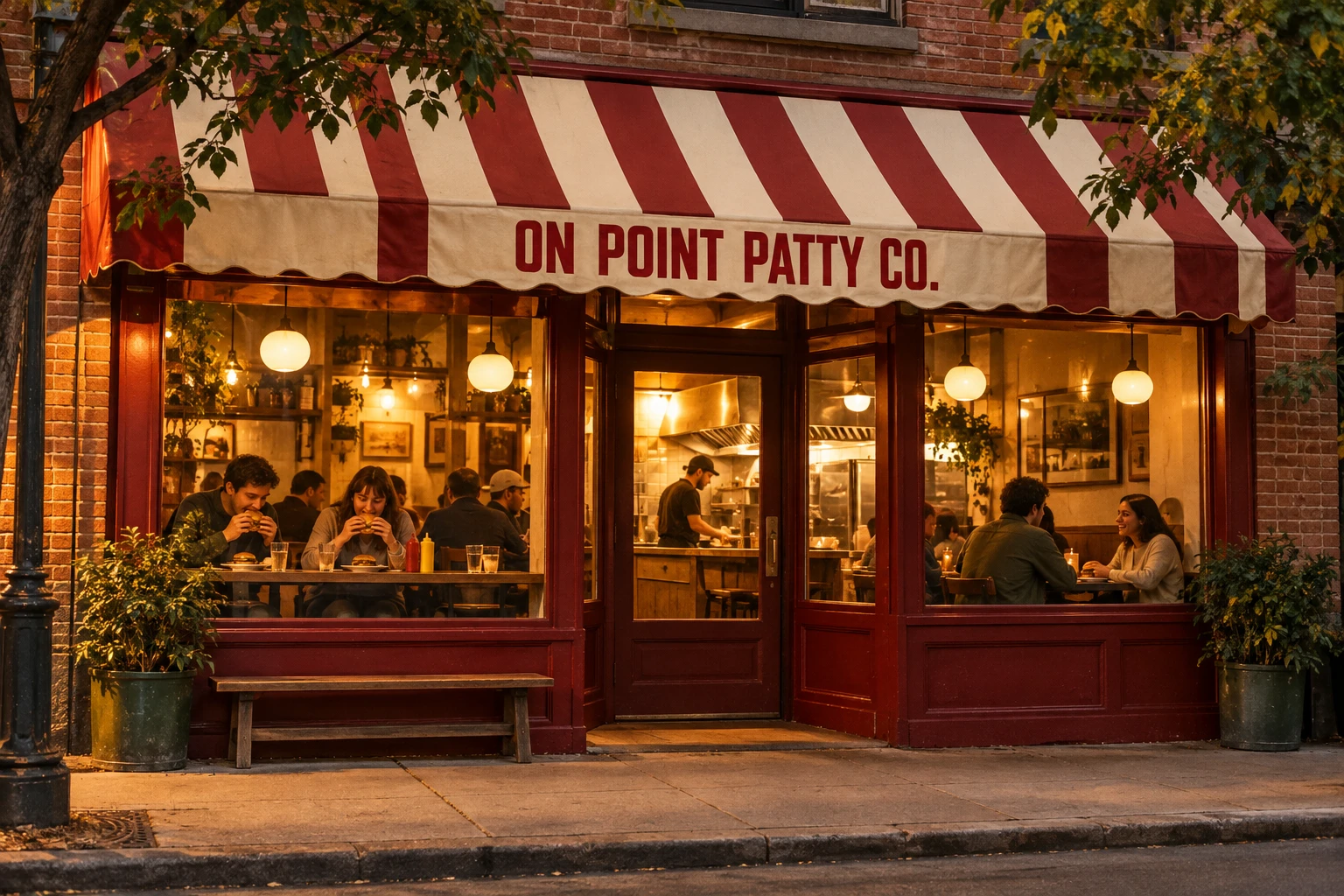 On Point Patty Co., a neighborhood burger counter with a striped awning and warm window seats